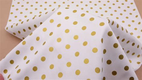 metallic gold polka dot fabric|spotty material.